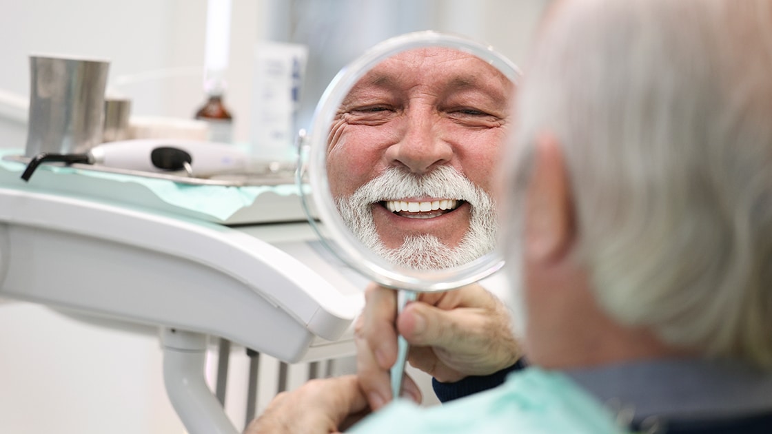 Mature man in mirror